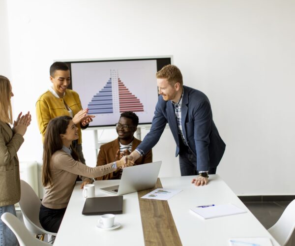 Group of young multiethnic business people working together and preparing new project on a meeting in the office